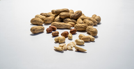 Fototapeta na wymiar Peanut set isolated on white background. Peanuts whole and peeled.