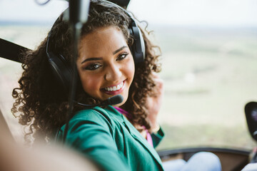 Successful smart stylish young latin woman in the helicopter. Luxury lifestyle concept © Nexa