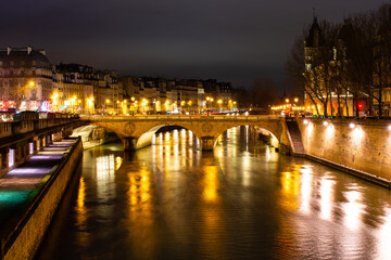 Fototapeta na wymiar Night Paris, Pont au Change, reflection of lights in the river Seine, cityscape