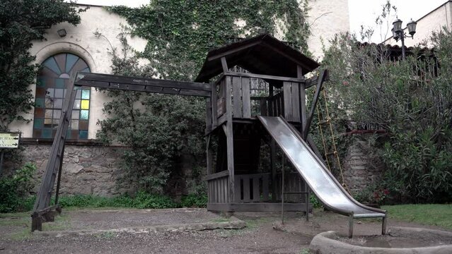 Wooden playground at the backyard of a castle