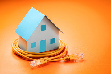 House model and network cable concept communication and online work