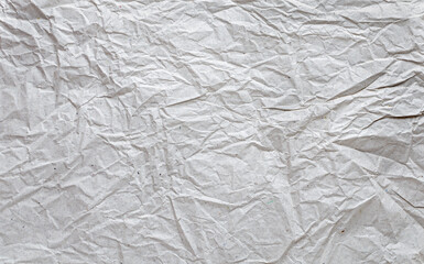 textured background of crumpled paper in a neutral color