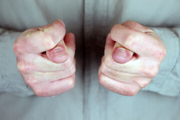Kukish - a fist with a thumb stuck between the index and middle fingers, as a rude gesture denoting...