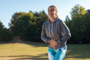 Young sporty woman has knee pain