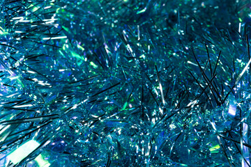 Blue tinsel. serpentine, background, blur. New Year holiday