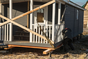 Delivery and installation of a modular frame house. Frame construction of small houses. Modular...
