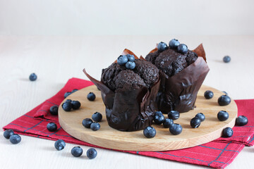 chocolate muffin and blueberries. sweet treat.