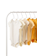 Rack with different baby bodysuits on white background