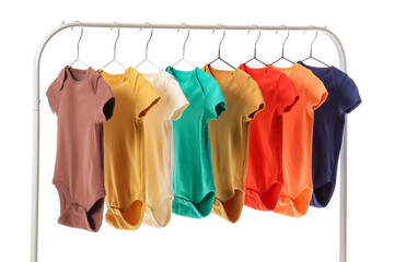 Rack with different baby bodysuits on white background