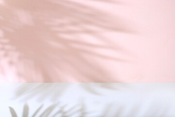 Premium empty podium with shadows of tropical palm leaves on pink wall,Minimal abstract background...