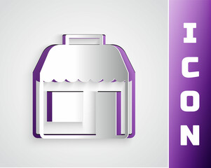 Paper cut Shopping building or market store icon isolated on grey background. Shop construction. Paper art style. Vector