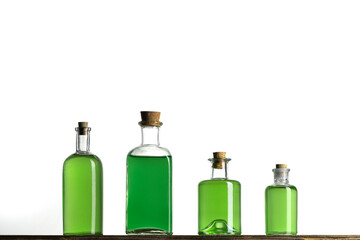Several glass transparent bottles with cork stopper on a shelf. Vintage glass bottles with  poisons...