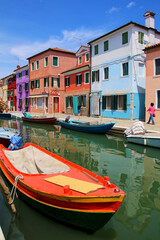 Boat anchored in canal in Burano, Venice, Italy