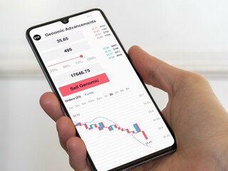 Stock exchange market chart etf, stock market data on smartphone. Business analysis of an genomic advancements ETF bear market