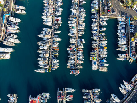 Aerial top view on costline and yachts harbor Puerto Colon on South of Tenerife near Costa Adeje, Canary islands, Spain