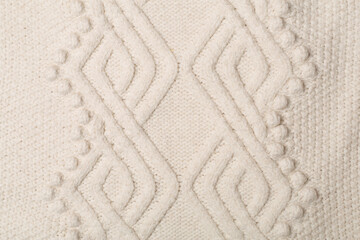 Knitted woolen sweater as background, closeup