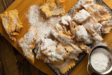 Italian Carnival food. angel wings on a woody background