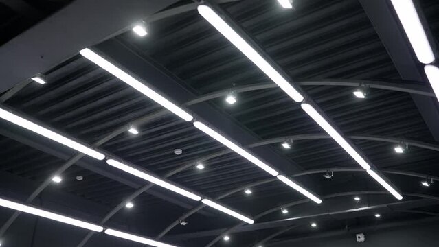 Steel roof frame, Car repair service center, The interior of a big industrial building or factory with steel constructions, inside the roof structure. Modern ceiling in a car repair shop.