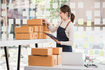 Small start-up business owners checking parcels at work, salespeople, checking production orders. Pack products for delivery to customers Sell ​​Ecommerce Shipping Ideas