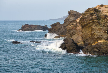 Fototapeta na wymiar Seascape. Waves breaking on the rocks.