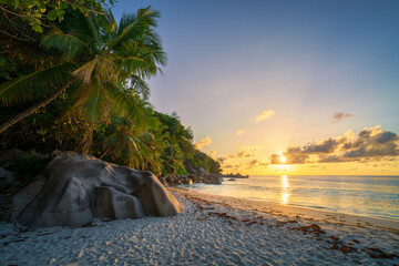 sunset at tropical beach anse georgette on praslin on the seychelles