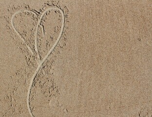 heart drawn in the sand
