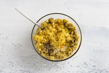 Cooking vegan lentil dumplings or patties. Raw soaked green lentils punched in blender and fried onion, salt, spices on light gray background, top view. Healthy Food Concept