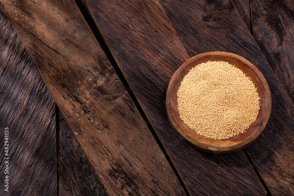 Sticker Amaranthus - Amaranth seeds in wooden bowl. Healthy food