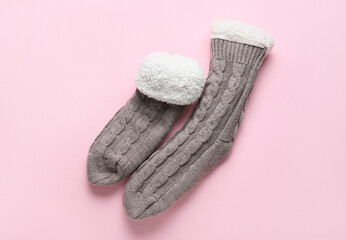 Warm socks on pink background