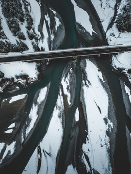 Arial Shot Of The Lech River With Bridge In Winter Snow