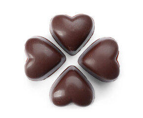 Tasty heart-shaped candies on white background