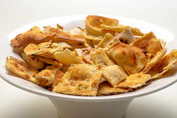 .Pizza cone served with rosemary and coarse salt, seasoned with olive oil