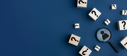Concept of finding a creative idea or solving a problem. Question mark on wooden cubes and a...