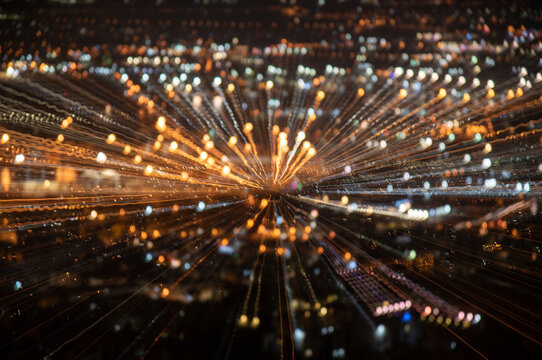 High Angle View Of City Lit Up At Night