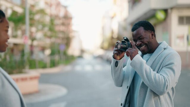 African american couple make picture using professional camera at street