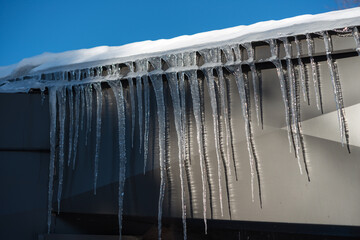 icicles on the side of a building with sheet metal detail 