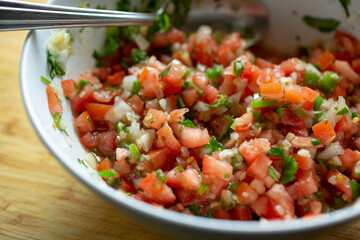A view of a bowl of pico de gallo salsa.