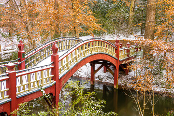 bridge in autumn with snow - obrazy, fototapety, plakaty