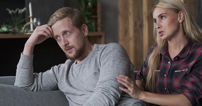 Upset man suffering feeling stress seasonal depression loneliness. Caring woman consoling husband with love and best feeling. Couple having conflict quarrel or trouble in relationship treason betrayal