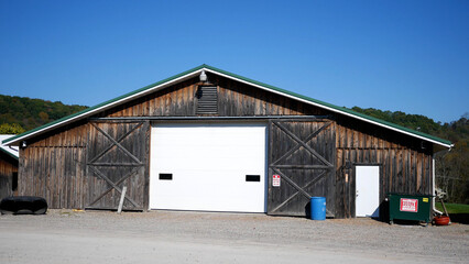 Fototapeta na wymiar Close Up of Old Barn or Warehouse in Country Setting - Hangar Storage Building