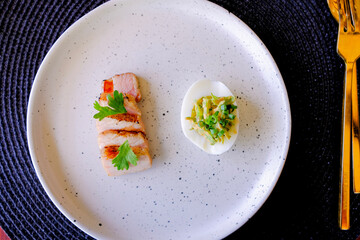 Marinated porks with Fish sauce and betel nut mix spicy sauce on the Egg
