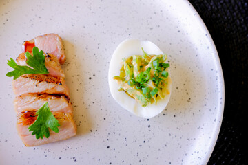 Marinated porks with Fish sauce and betel nut mix spicy sauce on the Egg
