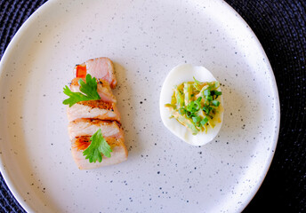 Marinated porks with Fish sauce and betel nut mix spicy sauce on the Egg
