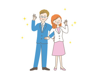 腕を組んでOKサインする男女のカップル