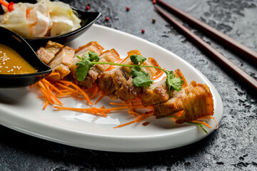 aromatic roast sliced pork with vegetables in hot sauce, chinese cuisine