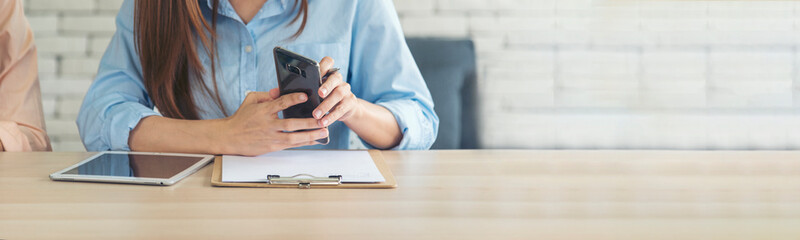 Banner Businesswoman reading financial graph charts business info with computer laptop. Panorama Women hands using laptop on office desk. Hands of business woman working office with copy space