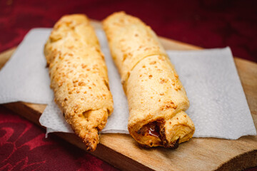 Chesse fingers on a table with a red background 