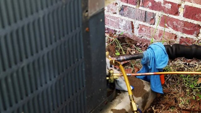 Technician brazing copper on an HVAC system