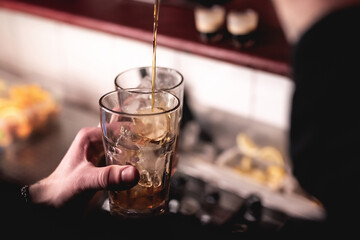 Bartender prepares cocktails in a nightclub