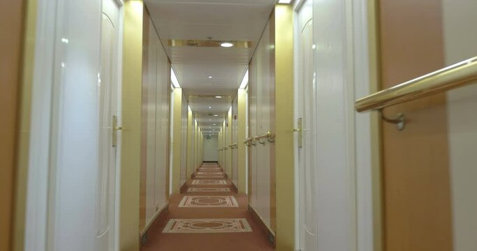 Moving in hotel corridor with light interior